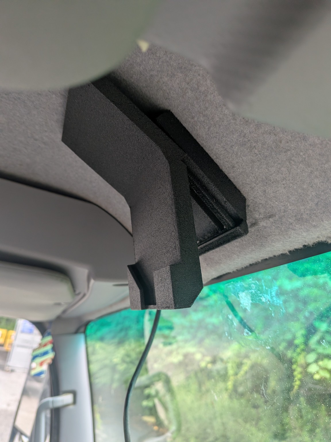 Custom 3D-printed camera bracket attached to the roof of a box truck before the camera is installed