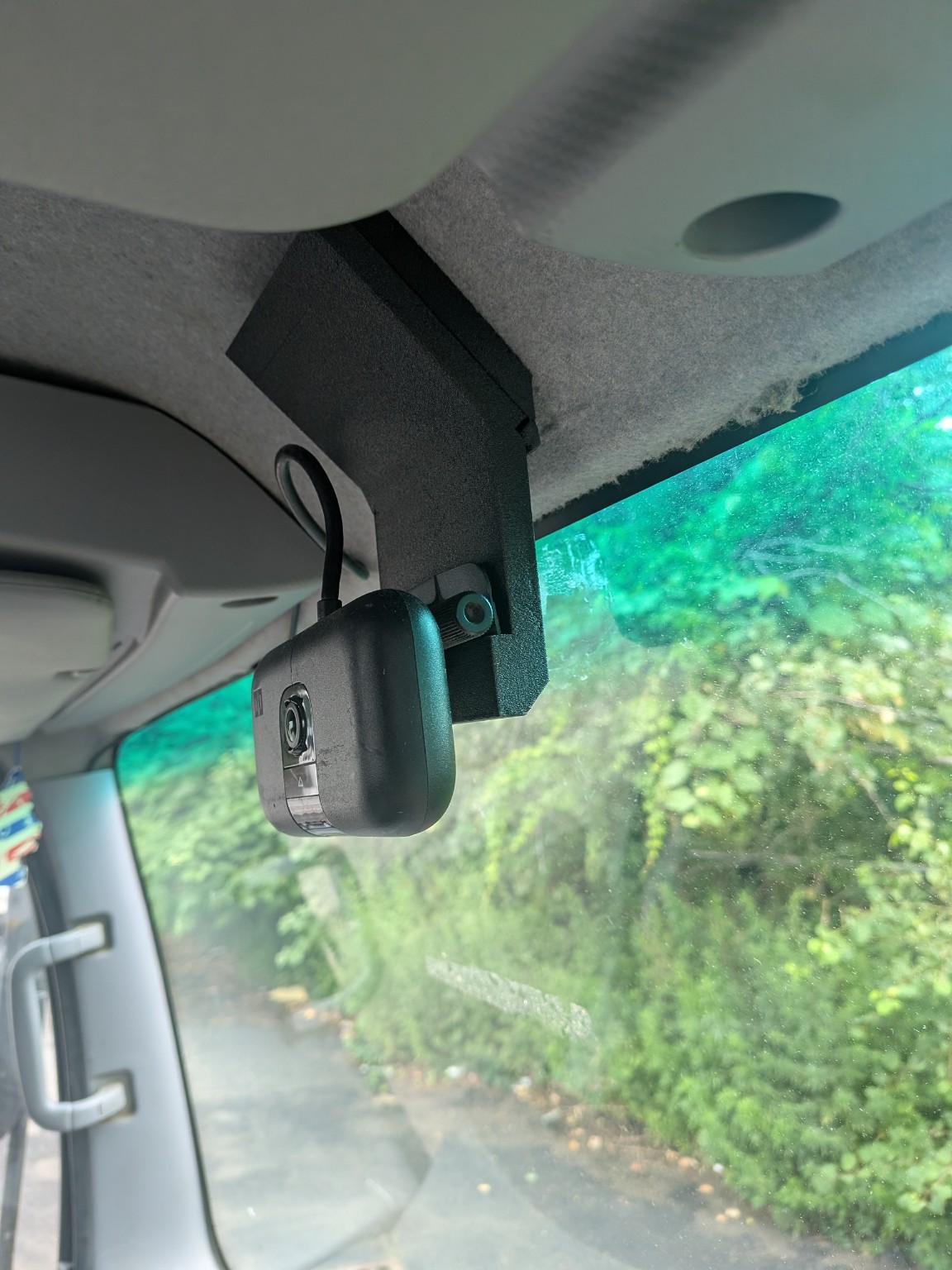 Motive camera secured to the custom roof mount inside a box truck